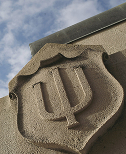 IU Trident on shield, in limestone